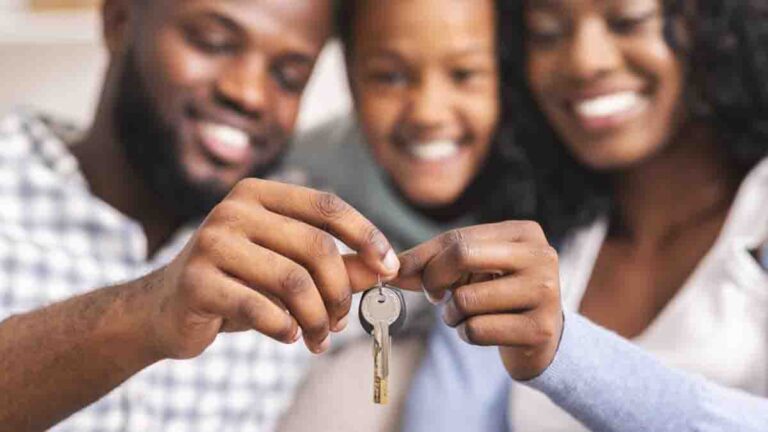 minority family holding house keys