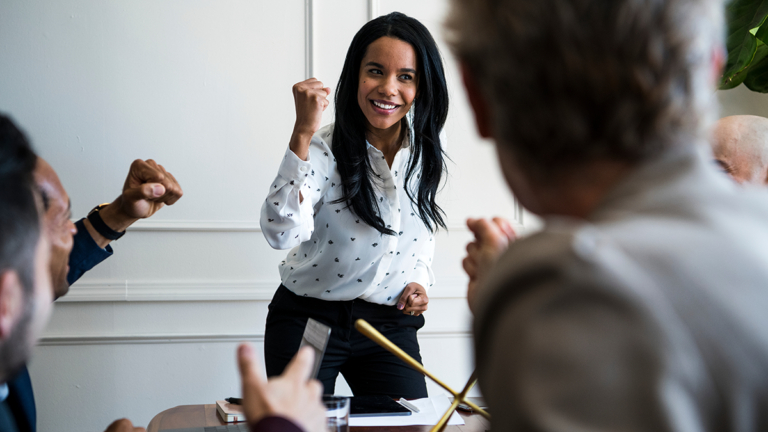 Young woman leading a team meeting